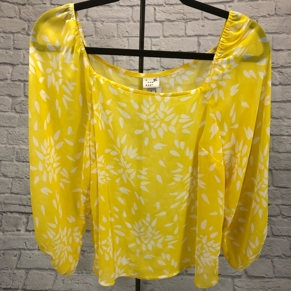 A New Day yellow white floral shear blouse. Size large. Scoop neck. Cuff sleeve